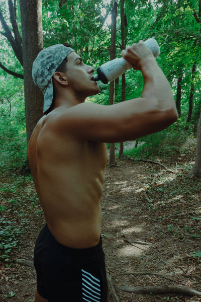 STENOS Men's Endurance Camo Running Hat worn during outdoor training